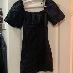Black mini dress with puff sleeves